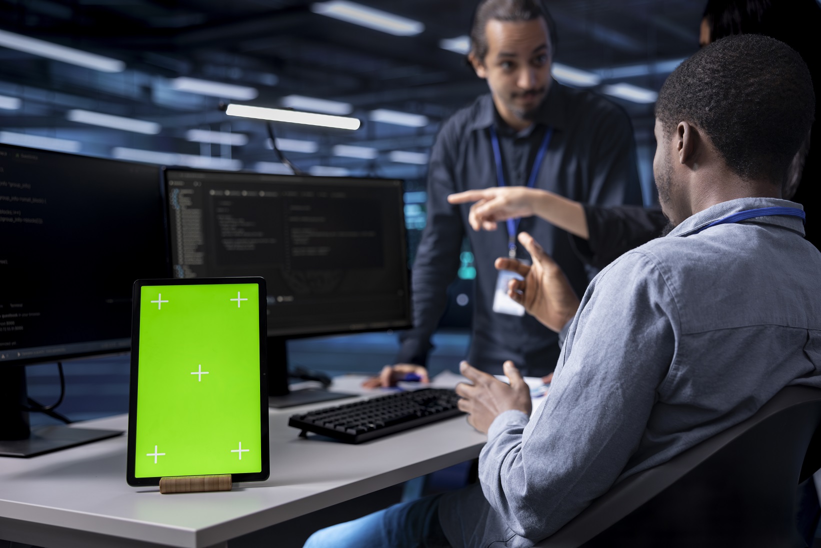 The web development process explained: from concept to launch. Multiethnic Team Using Green Screen Tablet To Over MVKF9J9